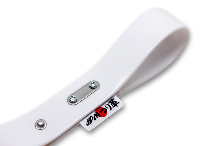 Close-up of the stainless steel screw-type fastener on a white tsurikawa strap.